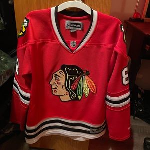 Selling a Chicago Blackhawks NHL home jersey size medium.